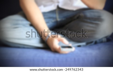 Man and his smart phone. Intentionally blurred editing post production background.