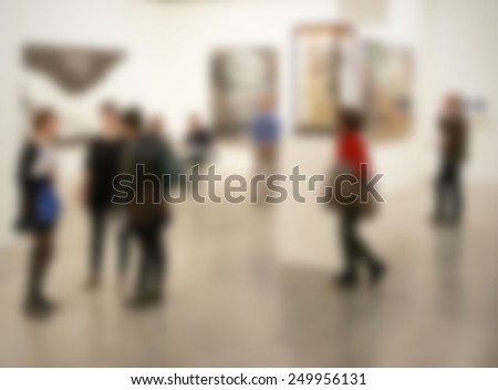 People visit art gallery, background. Intentionally blurred editing post production background.