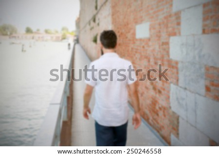 Man goes away. Intentionally blurred editing post production background.