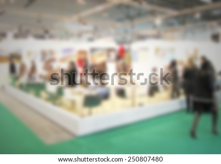 People visit a trade show. Intentionally blurred editing post production.