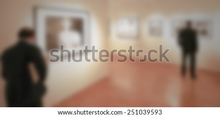 Photography gallery, people background. Intentionally blurred editing post production. Location, works and people not recognizable.