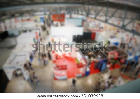 Trade show, panoramic view, generic background. Intentionally blurred editing post production. Fish eye effect.