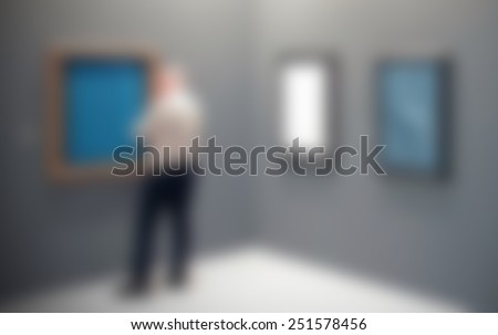Art exhibition, generic background. People, location and works not recognizable. Intentionally blurred editing post production.