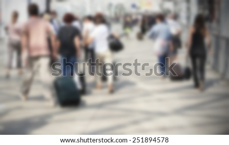 Commuters background. Intentionally blurred editing post production. Humans not recognizable.