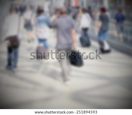 People background. Intentionally blurred editing post production. Humans not recognizable.
