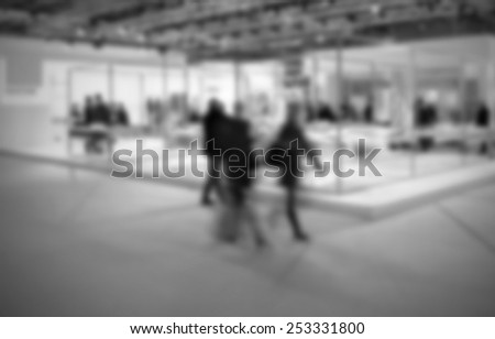 Trade show people background. Intentionally blurred, editing post production. Black and white.