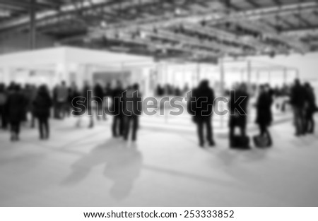 Trade show people background. Intentionally blurred, editing post production. Black and white.