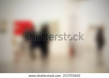 People at art gallery, background. Intentionally blurred editing post production.