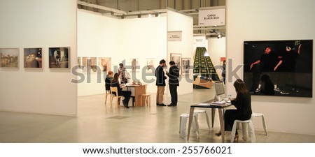 MILANO, ITALY - APRIL 08, 2011: People visit paintings galleries during MiArt, international exhibition of modern and contemporary art in Milano, Italy.
