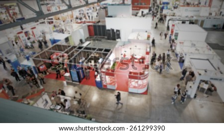 Trade show people, background. Intentionally blurred editing post production.