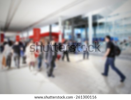 Trade show people, background. Intentionally blurred editing post production.