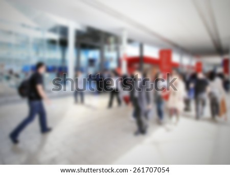 People join trade show, background. Intentionally blurred editing post production.