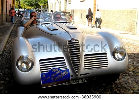 MANTUA, ITALY - SEPT. 18: A rare vintage car parades at a veteran cars event Gran Premio Nuvolari in honor of famous Italian car champion Tazio Nuvolari September 18, 2009 in Mantua, Italy.