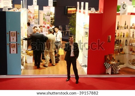 MILAN, ITALY - JUNE 10: Phone meeting outside a stand at Tuttofood 2009, World Food Exhibition June 10, 2009 in Milan, Italy.