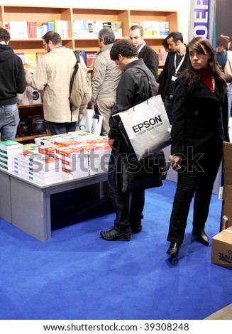 MILAN, ITALY - OCT. 21: People looking for books at SMAU, national fair of business intelligence and information technology October 21, 2009 in Milan, Italy.