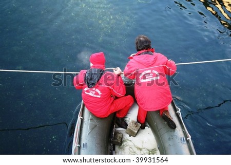 MILAN, ITALY - JAN. 26: Frogmen check security measures before historical winter swim endeavor at Naviglio Grande, main canal of the city January 26, 2009 in Milan, Italy.