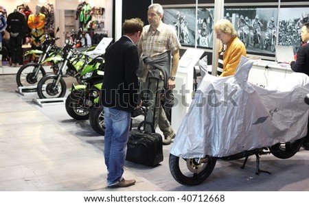 MILAN, ITALY - NOV. 11: People talking about models at EICMA, 67th International Motorcycle Exhibition November 11, 2009 in Milan, Italy.