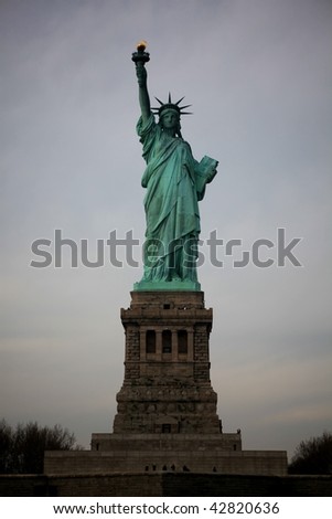 Statue of Liberty, New York, on grey sky background