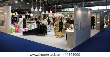 MILAN, ITALY - JANUARY 15: People walking trough stands dedicated to home furnishings and lights at Macef, International Home Show Exhibition January 15, 2010 in Milan, Italy.