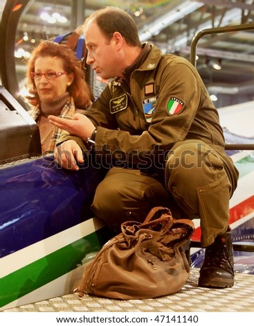 MILAN, ITALY - FEBRUARY 20: Member of Frecce Tricolori italian acrobatic flight, talk to people during BIT, International Tourism Exchange Exhibition February 20, 2010 in Milan, Italy.