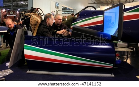 MILAN, ITALY - FEBRUARY 20: People testing Virtual Flying Group system at BIT, International Tourism Exchange Exhibition February 20, 2010 in Milan, Italy.