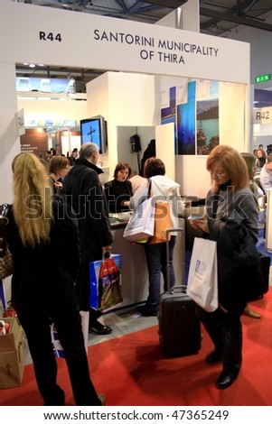 MILAN, ITALY - FEBRUARY 20: People asks info at Santorini stand during BIT, International Tourism Exchange Exhibition February 20, 2010 in Milan, Italy.
