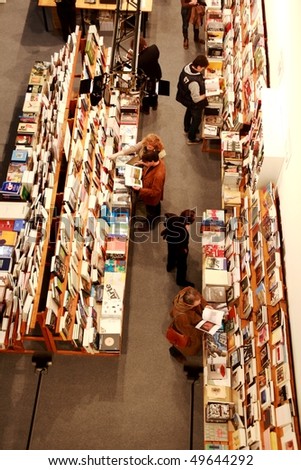 MILAN, ITALY - MARCH 27: People look for art books at MiArt ArtNow, international exhibition of modern and contemporary art March 27, 2010 in Milan, Italy.