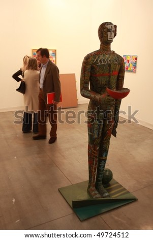 MILAN, ITALY - MARCH 27: People look at works of art at MiArt ArtNow, international exhibition of modern and contemporary art March 27, 2010 in Milan, Italy.