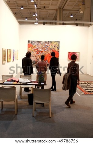 MILAN - MARCH 27: People visit painting galleries at MiArt ArtNow, international exhibition of modern and contemporary art March 27, 2010 in Milan, Italy.