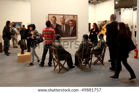 MILAN - MARCH 27: People look at Manel Morela work of art at MiArt ArtNow, international exhibition of modern and contemporary art March 27, 2010 in Milan, Italy.