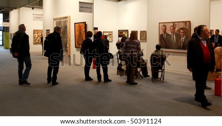 MILAN - MARCH 27: People look at Manel Mayoral work of art at MiArt ArtNow, international exhibition of modern and contemporary art March 27, 2010 in Milan, Italy.