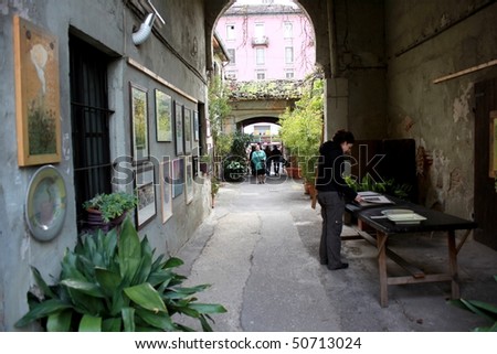 MILAN, ITALY - APRIL 11: People look for work for arts at laboratory art at the annual Flowers Market in the fashion and culture Navigli area April 11, 2010 in Milan, Italy.