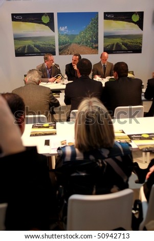 VERONA - APRIL 08: Meeting at Maremma wine share stand in the Tuscany regional pavilion at Vinitaly, international wine and spirits exhibition April 08, 2010 in Verona, Italy.