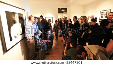 MILAN, ITALY - JUNE 16: People look at Phil Stern photos exhibition at Forma Photography Foundation June 16, 2010 in Milan, Italy.