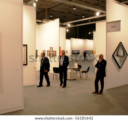 MILAN - MARCH 27: People look at works of art during MiArt ArtNow, international exhibition of modern and contemporary art March 27, 2010 in Milan, Italy.