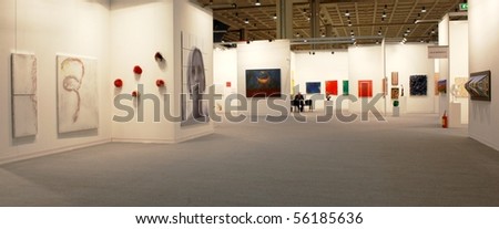 MILAN - MARCH 27: People look at works of art during MiArt ArtNow, international exhibition of modern and contemporary art March 27, 2010 in Milan, Italy.