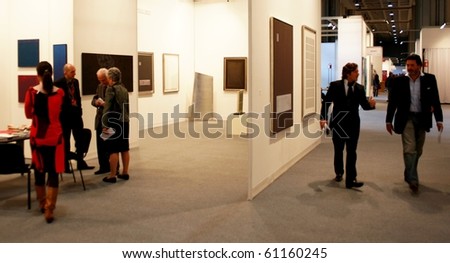 MILAN - MARCH 27: People look at works of modern art during MiArt ArtNow, international exhibition of modern and contemporary art March 27, 2010 in Milan, Italy.