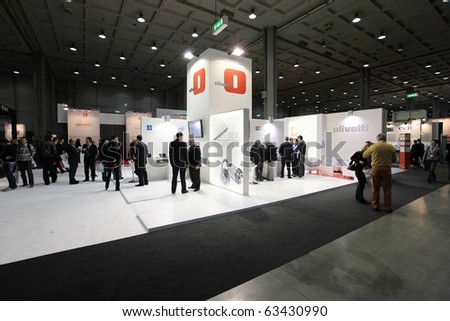 MILAN, ITALY - OCT. 20: People visit Olivetti technologies stand at SMAU, international fair of business intelligence and information technology October 20, 2010 in Milan, Italy.