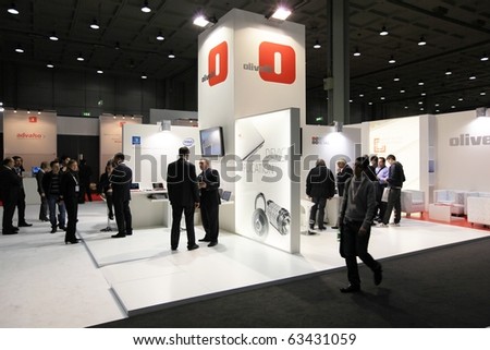 MILAN, ITALY - OCT. 20: People visit Olivetti technologies stand at SMAU, international fair of business intelligence and information technology October 20, 2010 in Milan, Italy.