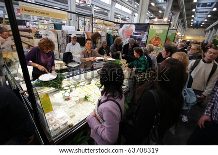 TORINO, ITALY - OCT. 24: People taste food at Salone del Gusto, international fair of tastes and slow food October 24, 2010 in Torino, Italy.