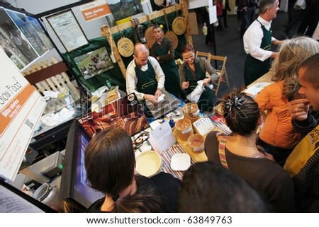 TORINO, ITALY - OCT. 24: People buy food at Salone del Gusto, international fair of tastes and slow food on October 24, 2010 in Torino, Italy.