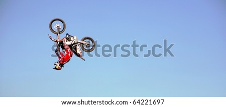 MILAN, ITALY - NOV. 11: Profile of motorcycle driver during acrobatic performance during Motolive show at EICMA, 67th International Motorcycle Exhibition November 11, 2009 in Milan, Italy.