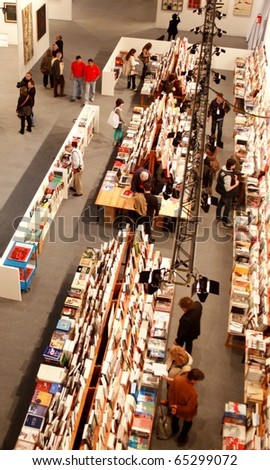 MILAN - MARCH 27: Panoramic view of people looking for art book at MiArt ArtNow, international exhibition of modern and contemporary art March 27, 2010 in Milan, Italy.