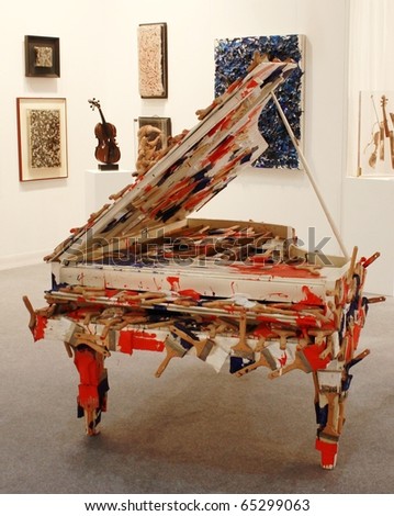 MILAN - MARCH 27: Close-up of piano and paintings gallery at MiArt ArtNow, international exhibition of modern and contemporary art March 27, 2010 in Milan, Italy.