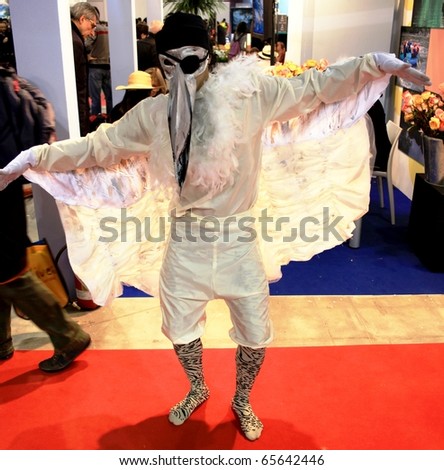 MILAN, ITALY - FEBRUARY 20: Actor with mask dancing at BIT, International Tourism Exchange Exhibition February 20, 2010 in Milan, Italy.