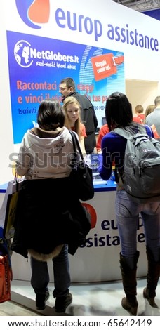 MILAN, ITALY - FEBRUARY 20: People ask for info at Europe Assistance stand at BIT, International Tourism Exchange Exhibition February 20, 2010 in Milan, Italy.