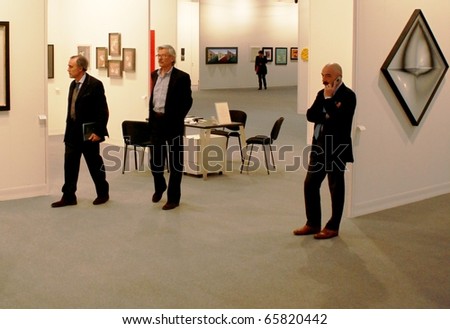 MILAN - MARCH 27: People visit paintings galleries at MiArt ArtNow, international exhibition of modern and contemporary art March 27, 2010 in Milan, Italy.