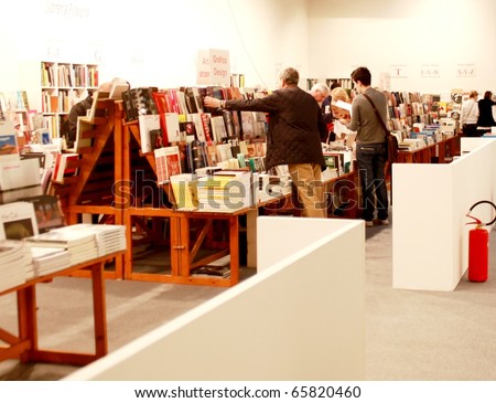 MILAN - MARCH 27: People look at book gallery at MiArt ArtNow, international exhibition of modern and contemporary art March 27, 2010 in Milan, Italy.