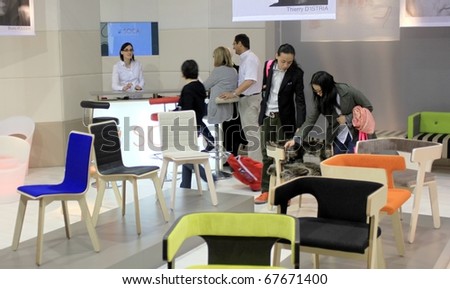MILAN - APRIL 15: People looking at interior design solutions in exhibition at Salone del Mobile, international furnishing accessories exhibition April 15, 2010 in Milan, Italy.