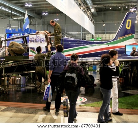MILAN, ITALY - FEBRUARY 20: People  participate to Frecce Tricolori anniversary during BIT, International Tourism Exchange Exhibition February 20, 2010 in Milan, Italy.